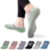 A collection of silicone anti-slip pilates and yoga socks in various shades of green and purple.