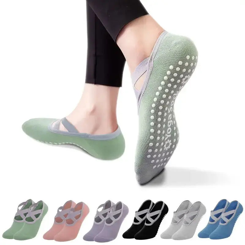 A collection of silicone anti-slip pilates and yoga socks in various shades of green and purple.