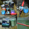 A collection of SOUGA BRAID fishing line spools and a finished braided line on a mossy rock.