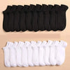 A set of black and white ankle socks for sports and casual wear displayed in a row.