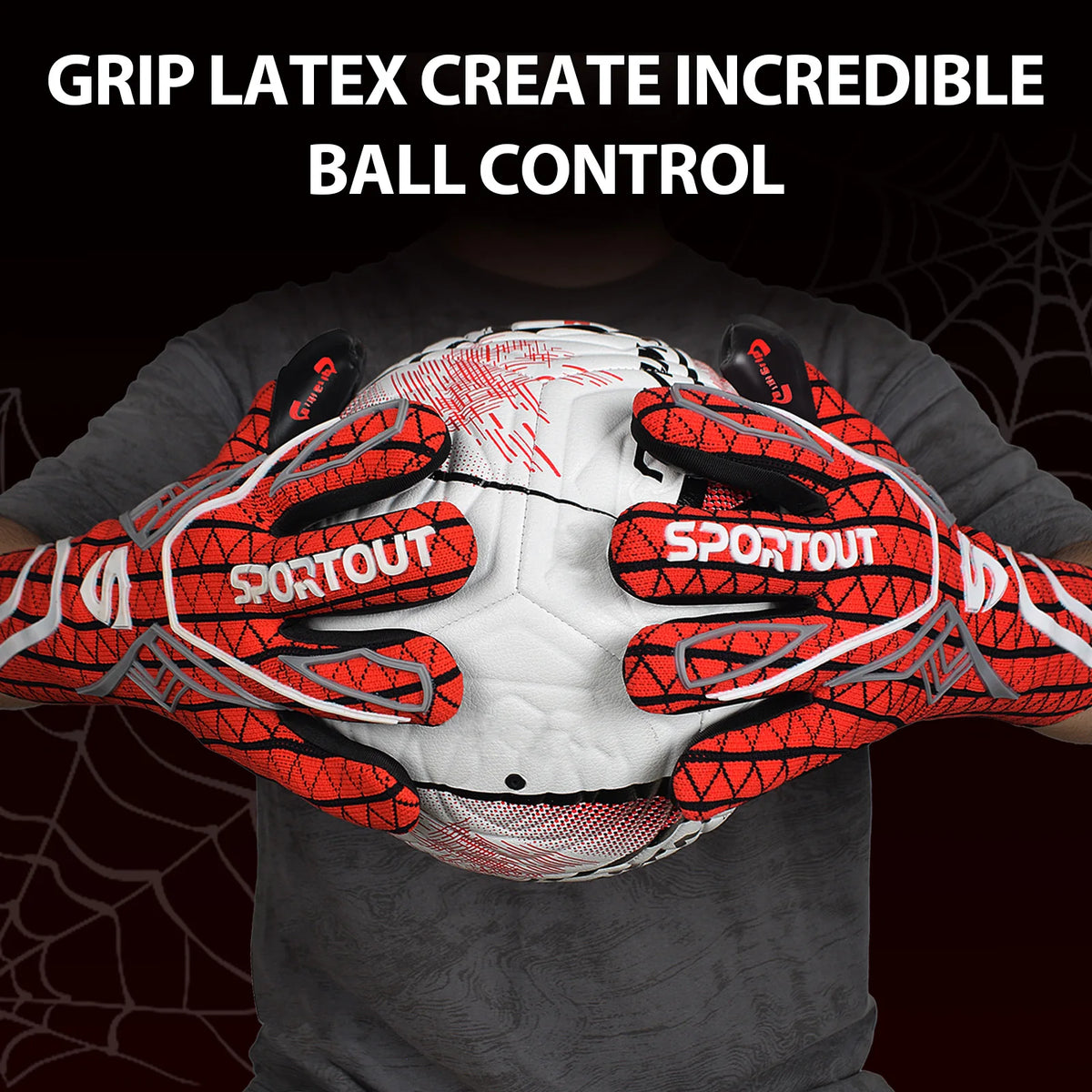 A hand wearing orange and black grip latex goalkeeper gloves is holding a white football.
