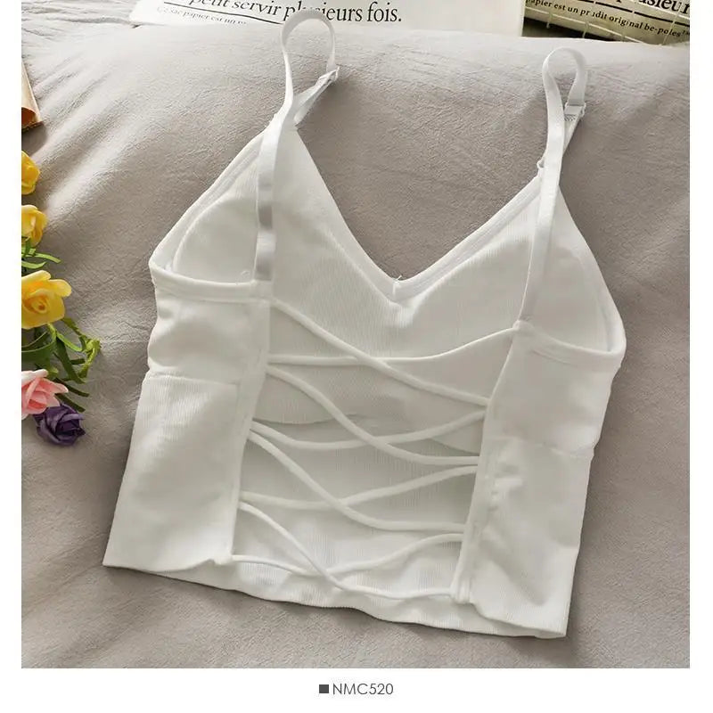 White off-shoulder camisole tank top for women displayed on a light surface.