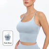 A model wearing a light blue summer strappy yoga sports bra top and matching bottoms.