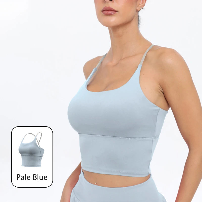 A model wearing a light blue summer strappy yoga sports bra top and matching bottoms.