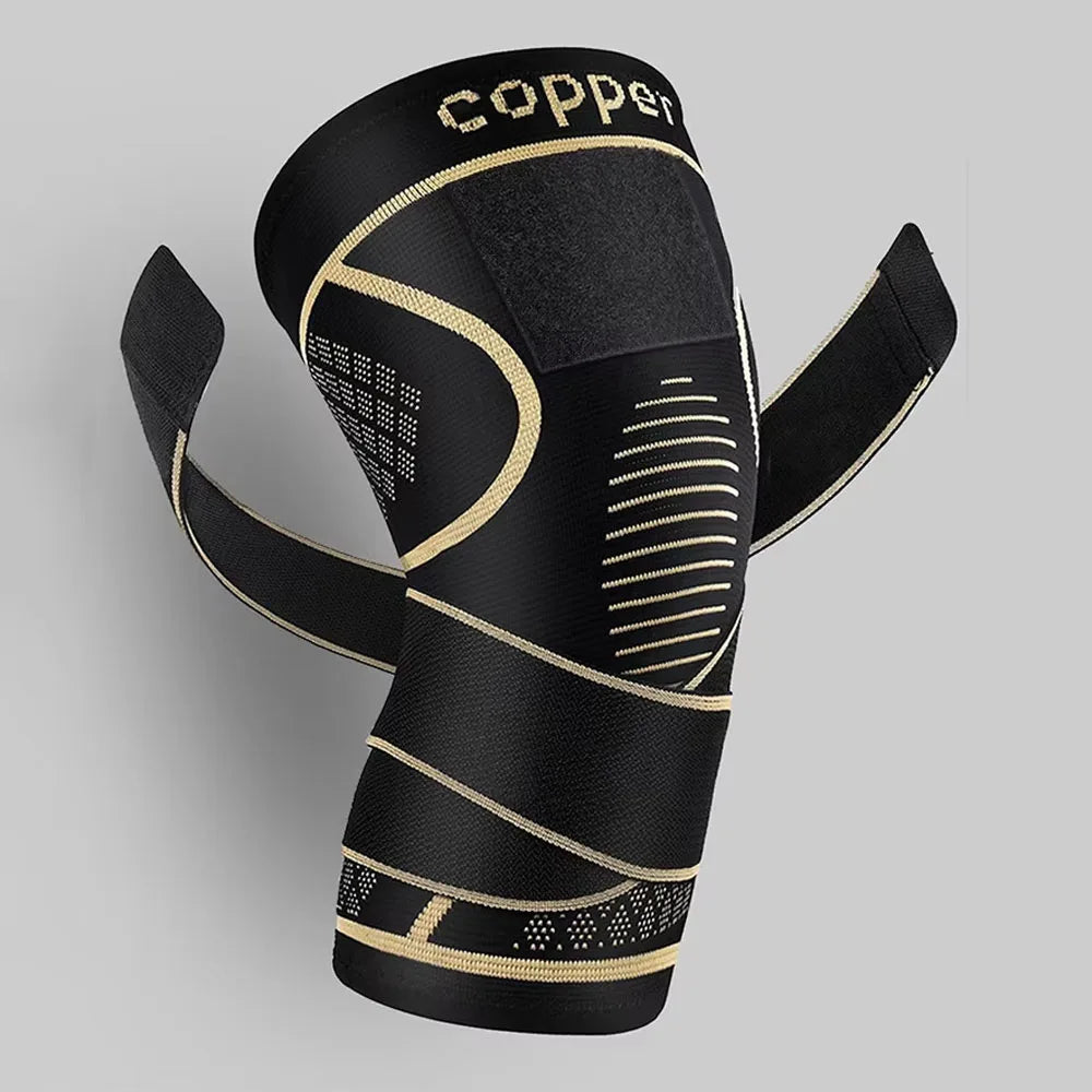 Black copper knee brace with gold stitching and strap for pain relief