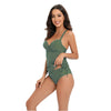 A woman models a green high-waisted two-piece swimsuit set.