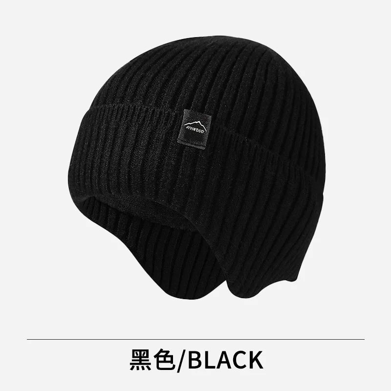 Black warm knitted winter knit hat with a textured, ribbed appearance.