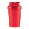 A red portable protein shaker bottle standing upright.