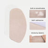 A beige self-adhesive stretchy fabric friction protection pad for thighs.