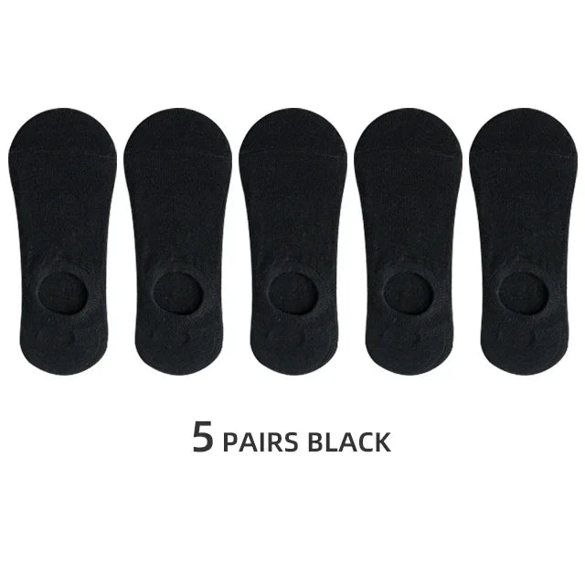 Five pairs of black men's invisible silicone no-show socks laid out side by side.