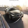 A black Infiniti car is shown driving on a road, with a lens effect highlighting the polarized sunglasses for men.