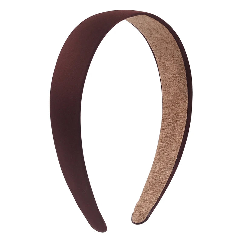 A pair of solid satin hair bands, one dark brown and one beige, shown in a curved shape.