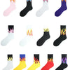 A collection of unisex novelty socks featuring various flame patterns in pink, black, white, purple, and yellow colors.