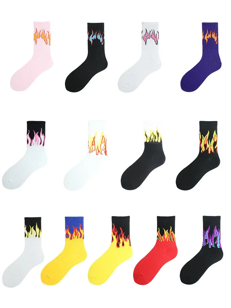 A collection of unisex novelty socks featuring various flame patterns in pink, black, white, purple, and yellow colors.