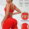 A model wearing a red, breathable, 4-way stretch athletic jumpsuit demonstrating comfort and support features.