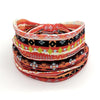 A stack of colorful bohemian stretch cotton headbands featuring geometric patterns in orange, black, and white.
