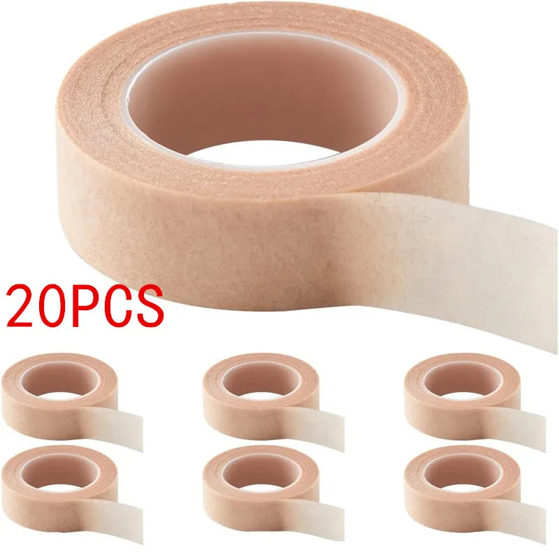 A roll of pink eyelash extension tape with 20 pieces shown in various angles.