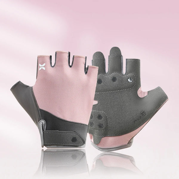 A pair of breathable half finger cycling gloves in pink and gray are displayed on a reflective surface.