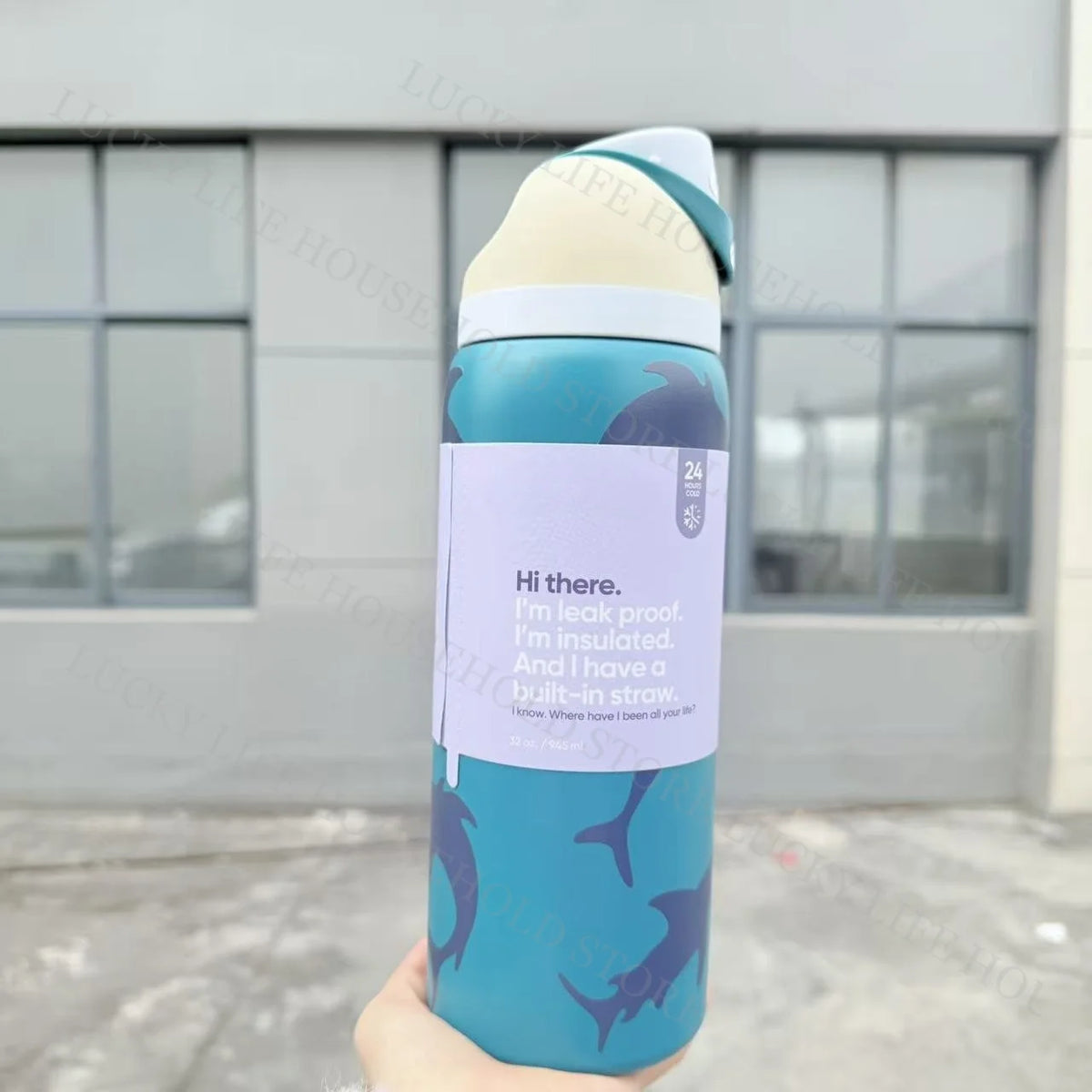 A light blue insulated stainless steel sports water bottle with a white lid and a dark blue graphic.