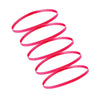 A set of five bright pink elastic sports headbands coiled in a spiral shape.