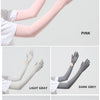 A collection of UPF 50+ sun protection arm sleeves in various colors including pink, light gray, dark gray, beige, and orange