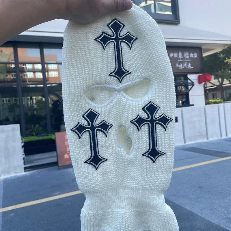 White knit balaclava beanie hat featuring black cross embroidery