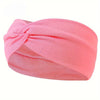 Pink knotted elastic sports headband for workouts and everyday wear