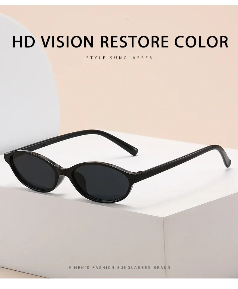 Black retro oval frame sunglasses displayed on a white box.