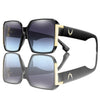 A pair of black square sunglasses with gold accents shown in a studio setting.