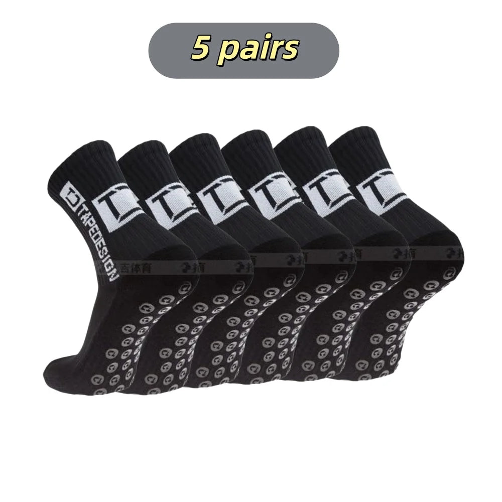 Five pairs of black mid-calf football socks with white lettering and a patterned design.