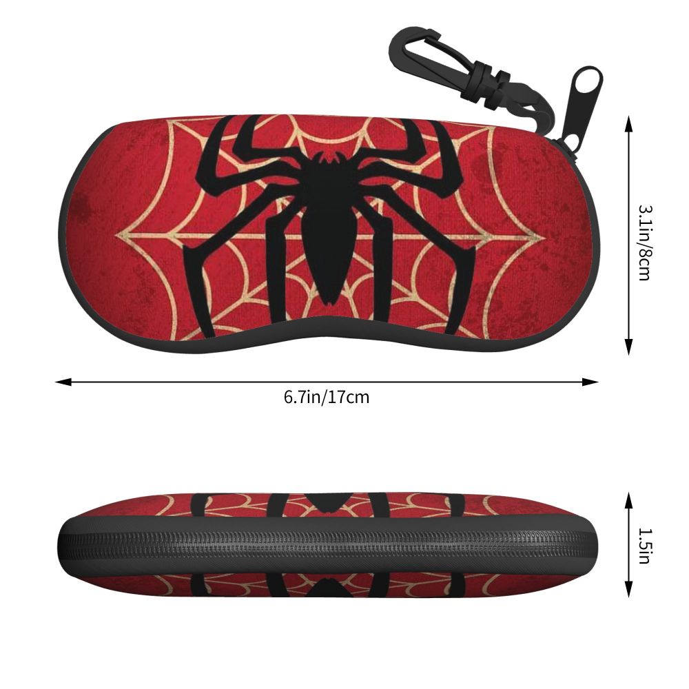A black spider web design on a red pouch for eyeglasses.