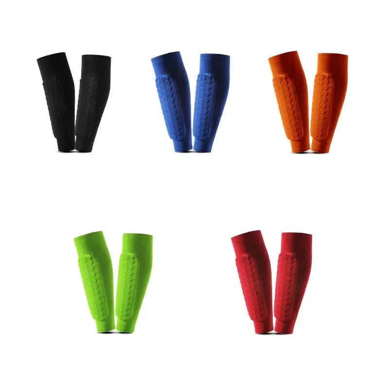 A set of five durable sports shin guards in black, blue, orange, and red.