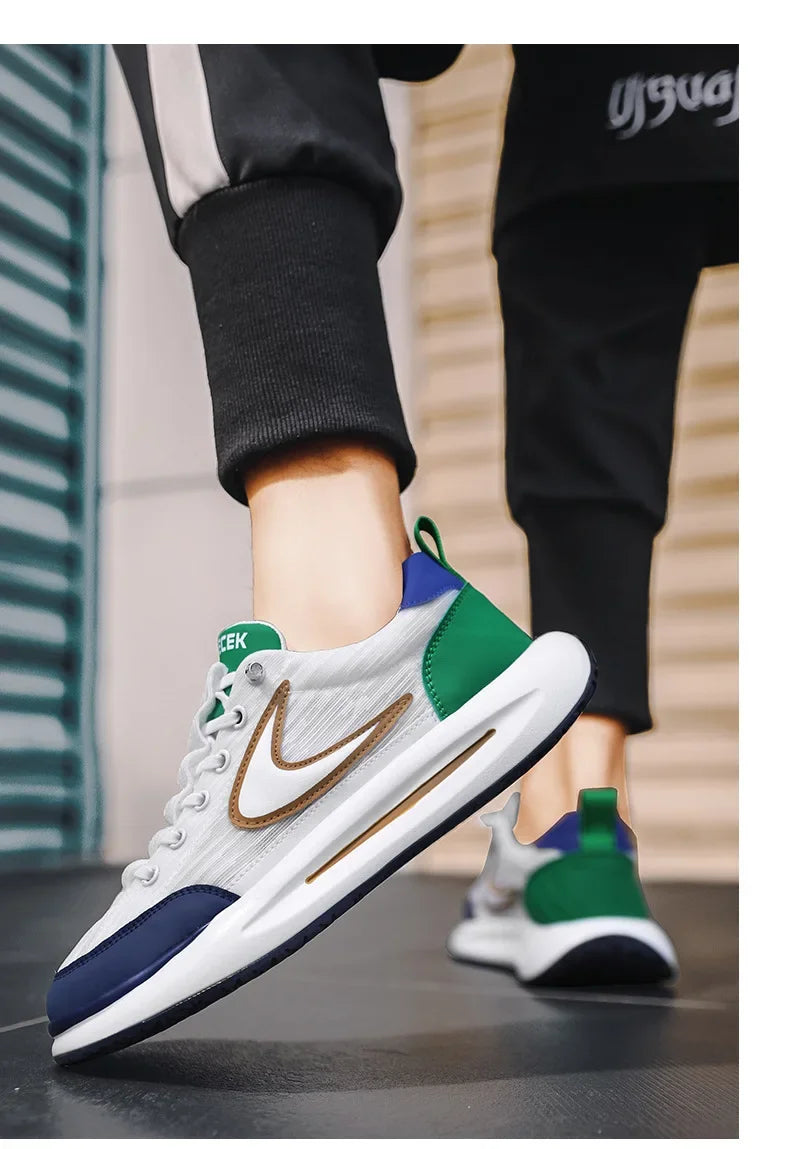 A close-up of a pair of white and green mesh running shoes with brown accents worn by a person.