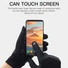 A hand wearing black sports gloves is touching a smartphone screen with the thumb and index finger.