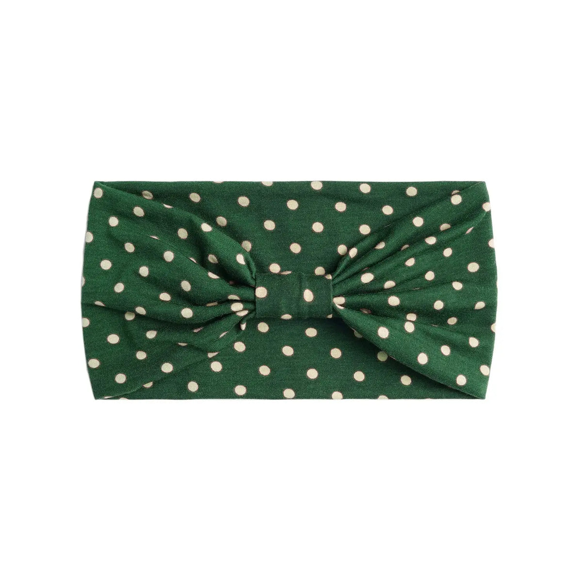 A dark green fabric headband with white polka dots tied in a bow.