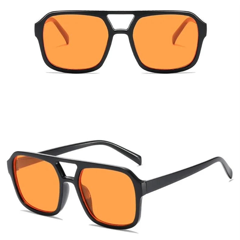 Gafas cuadradas tintadas de naranja con montura negra, vistas de frente.