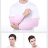 A man wearing white clothing demonstrates the pink cooling arm sleeves for UV protection.