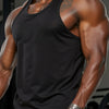 A muscular man wearing a black men's quick dry breathable sleeveless tank top.