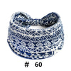 A navy blue and white patterned knitted headband for yoga or workout