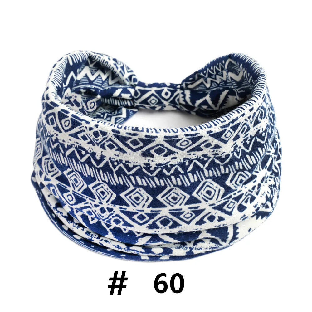 A navy blue and white patterned knitted headband for yoga or workout