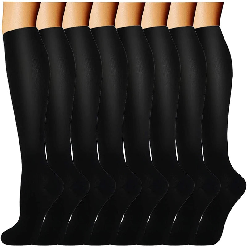 A set of black compression socks for vein support displayed vertically.