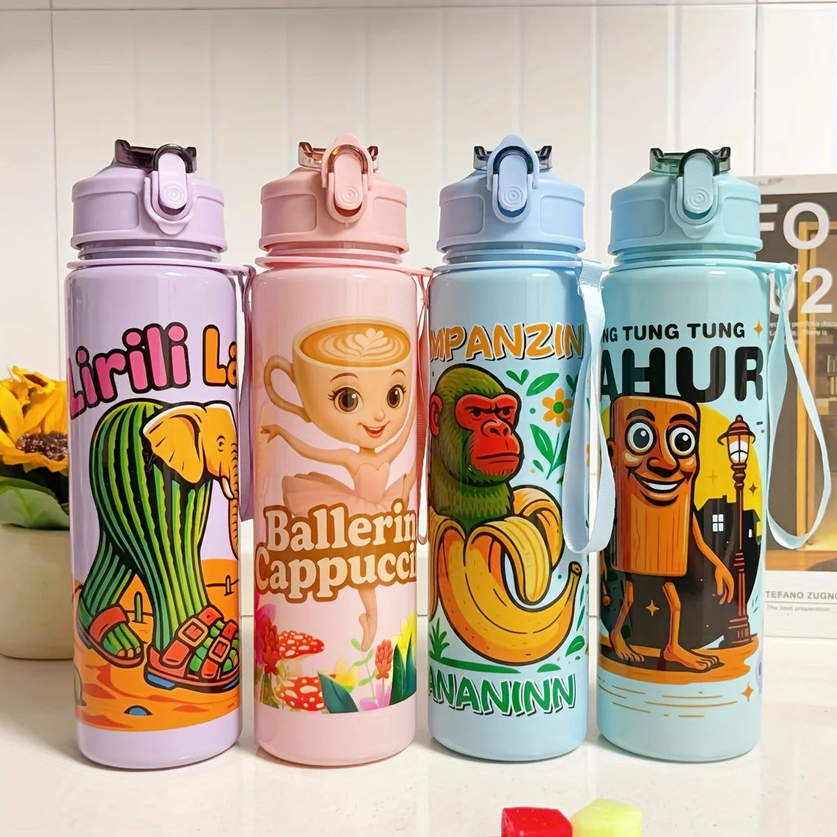 Four colorful insulated sports water bottles featuring different cartoon characters and designs.