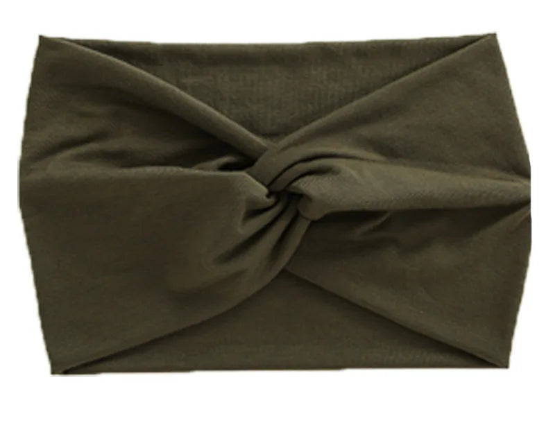 A dark olive green women's elastic sports headband tied in a knot.
