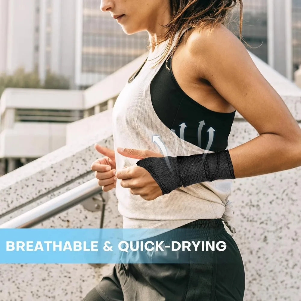 A woman wearing a black self-adhesive elastic bandage tape on her forearm while exercising outdoors.
