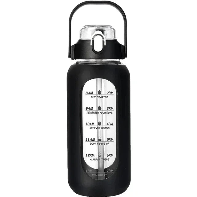 Schwarze wiederverwendbare Glasflasche mit klapp- und Strohhalmverschluss, mit Zeitmarkierungen am Körper.