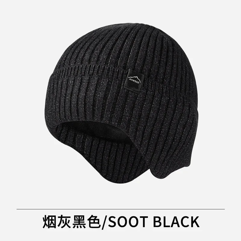 A black knitted winter hat shown against a white background.