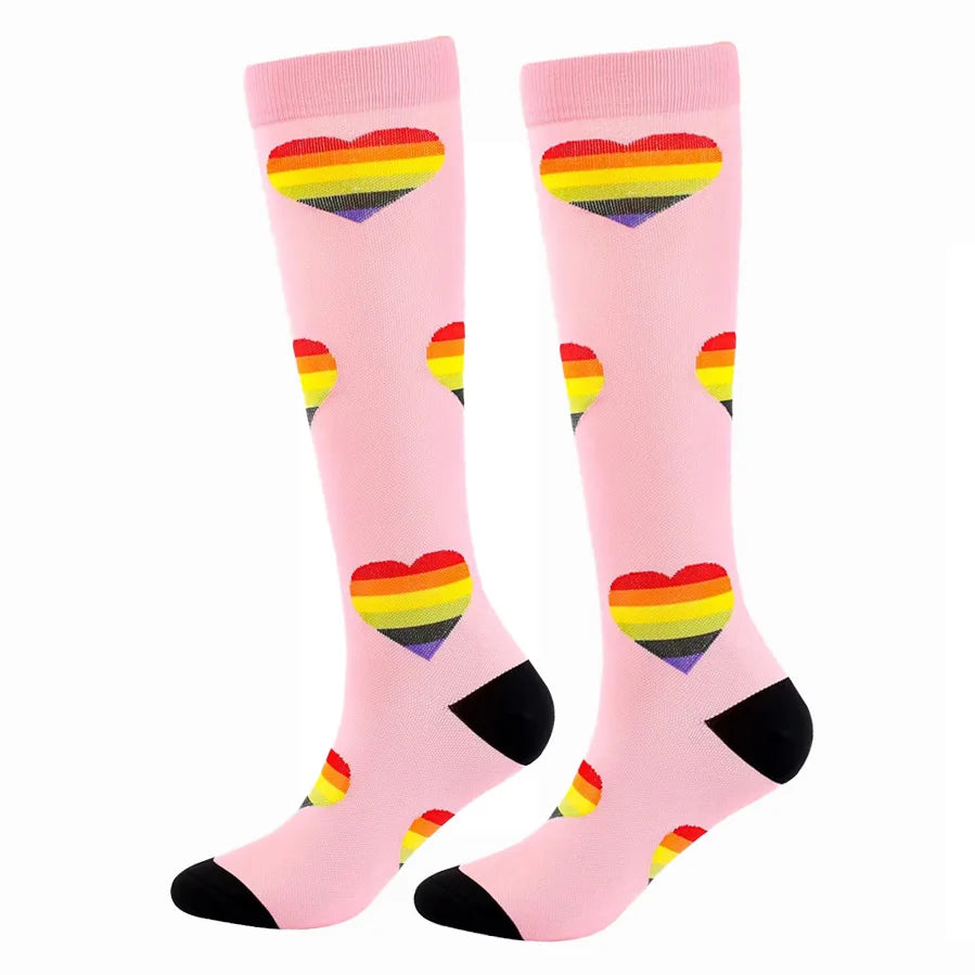 A pair of pink compression elastic socks featuring a rainbow heart design.