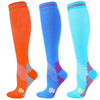 Three pairs of medical grade compression socks in orange, blue, and cyan.