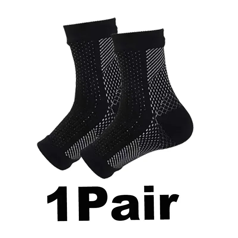 A pair of black compression ankle support braces shown flat.