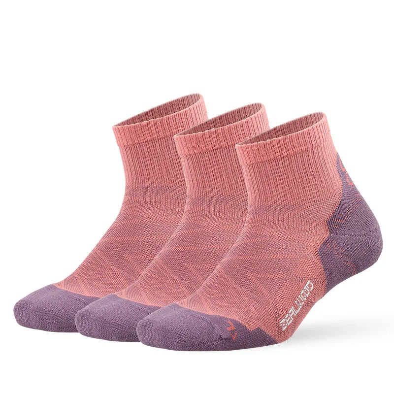 A pair of breathable performance running socks in a dusty rose and purple colorway.